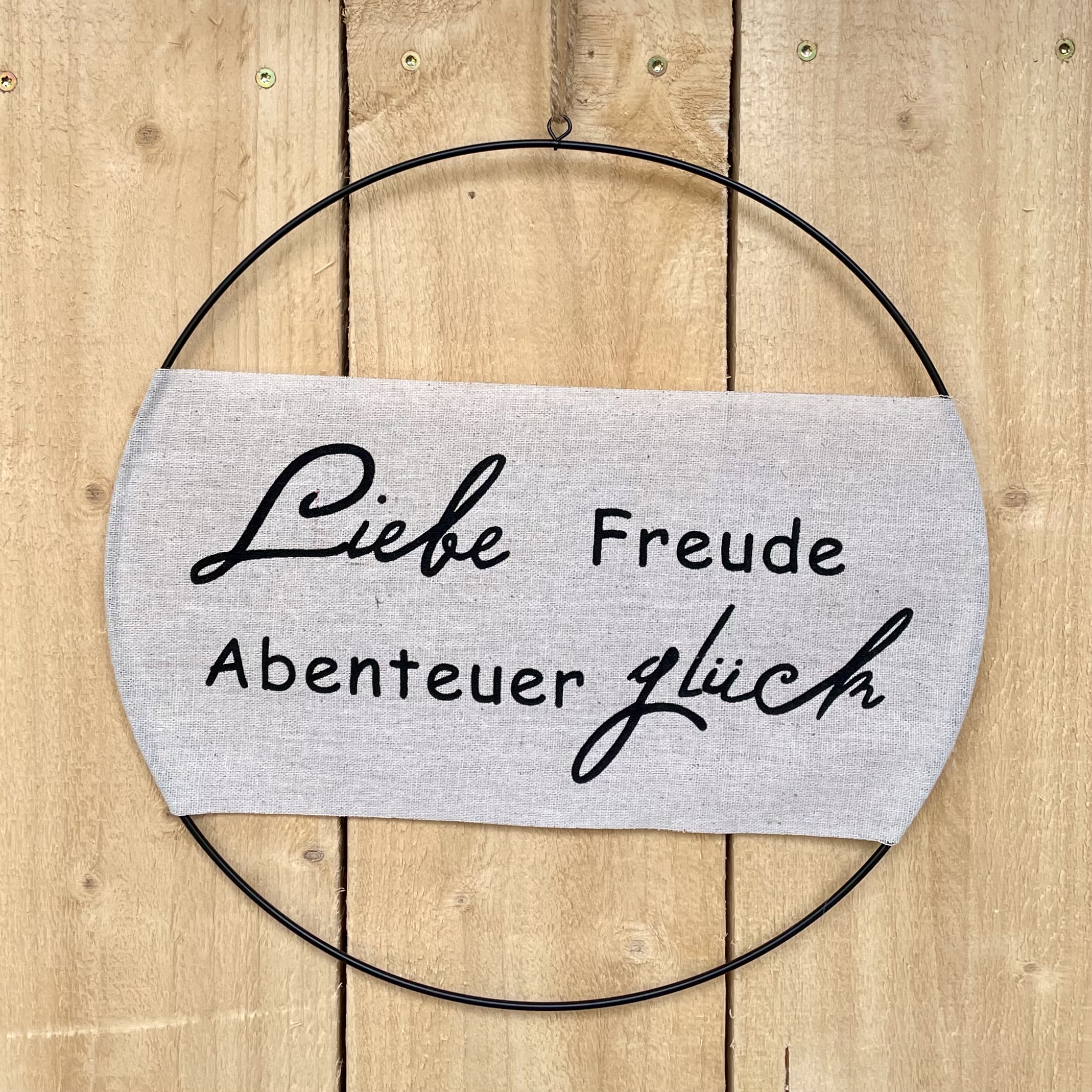 Spruchring mit Stoff "Liebe, Freude, Abenteuer, Glück" D30cm, schwarz/natur